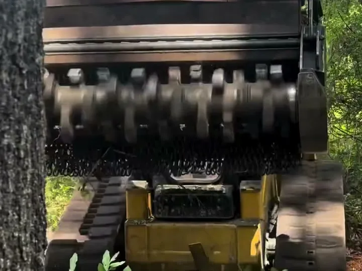 Forestry mulcher drum and teeth on the track loader used to cut shooting lanes
